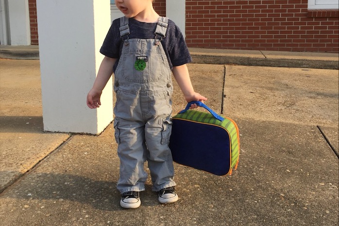 Toddler with lunchbox