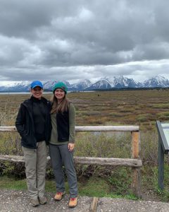 Mom and daughter in front of the Grand Teton mountains